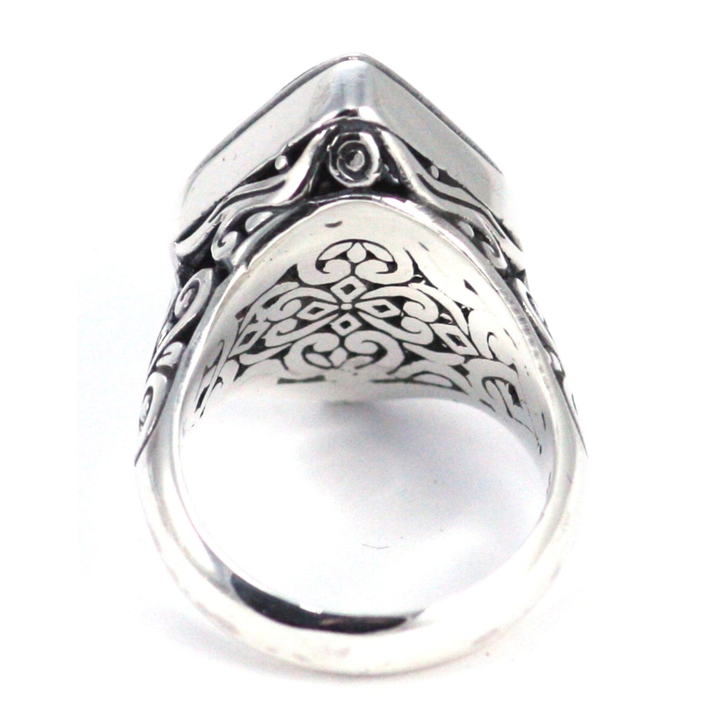 Sterling silver ring with ornate design.