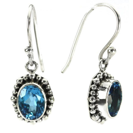 Sterling silver earrings with faceted Swiss blue topaz gemstones.